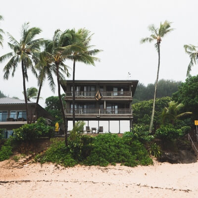 A front elevation view of an oceanfront cottage from the water